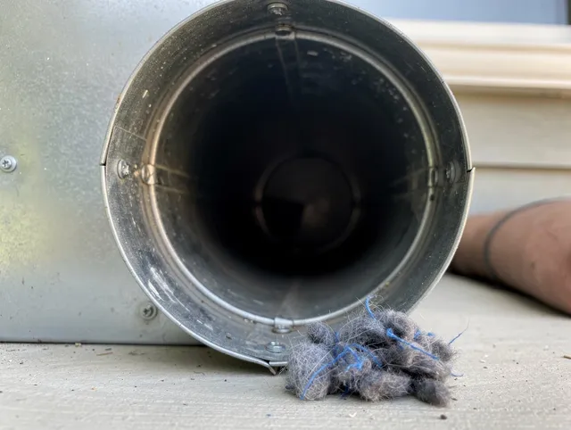 Georgetown Dryer Vent Cleaning technician using specialized equipment to clear severe dryer vent blockage in Georgetown